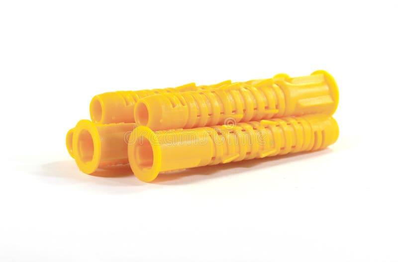 Wall plug - also known as anchor or dowel, in different colors and sizes on one pile, isolated on white,. Plastic tool royalty free stock photography Wall plug - also known as anchor or dowel, in different colors and sizes on one pile, isolated on white,. Plastic tool royalty free stock photography