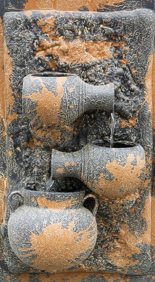 Wall pottery fountain stock image
