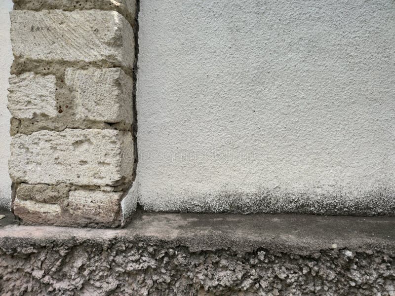 Wall of Rectangular Bricks with Gray Cement between Stones and Smooth