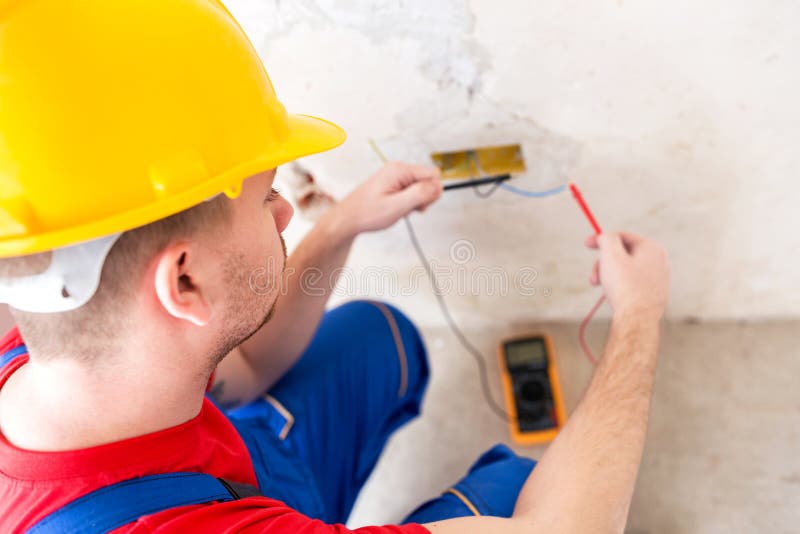 Wall socket current checking with unimer royalty free stock photo Wall socket current checking with unimer royalty free stock photo