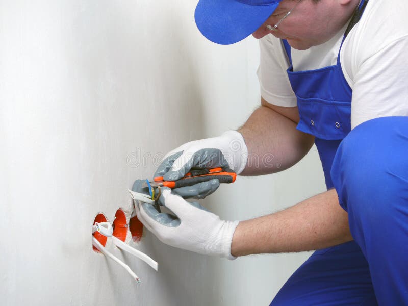 Wall socket installation stock photos