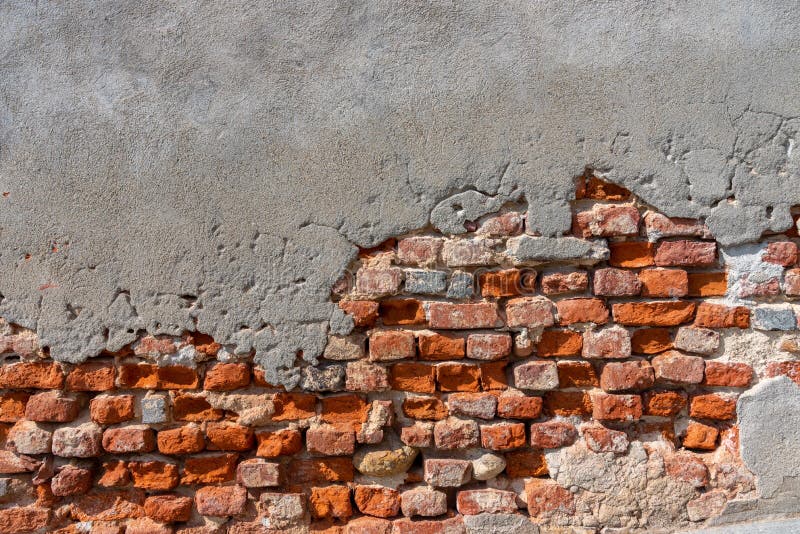 Wall Texture with Ancient Plaster with Exposed Red Brick Stock Photo