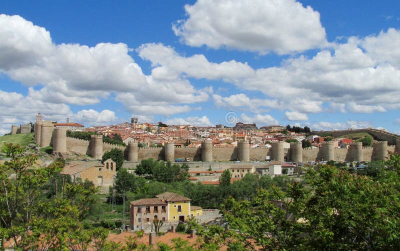 Wall, tower and bastion of Avila, Spain, made of yellow stone bricks