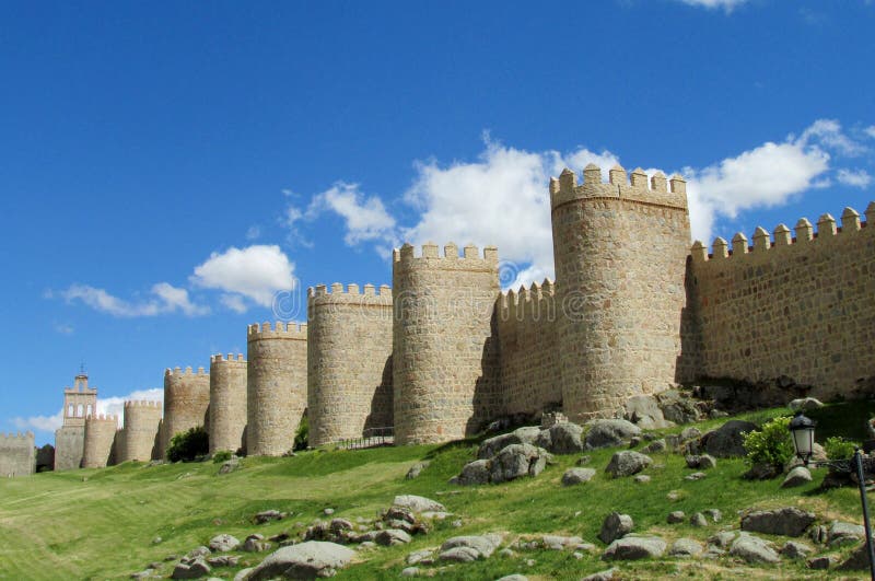 Wall, tower and bastion of Avila, Spain, made of yellow stone bricks