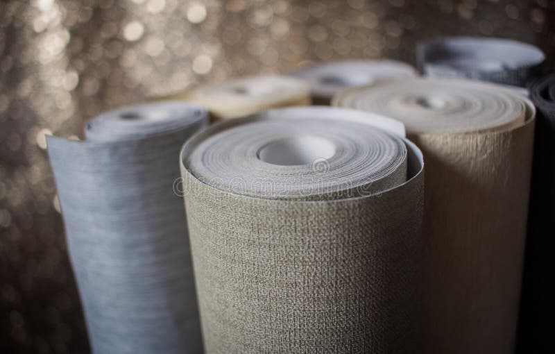 Wallpaper rolls displayed. Shiny background. royalty free stock images