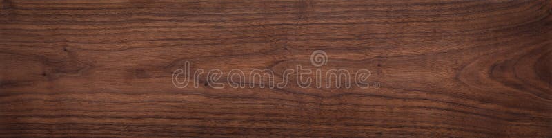 Walnut wood texture.  Natural texture background of North American walnut wood board.  Long wood plank texture.