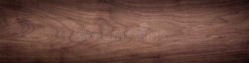 Walnut wood texture. Natural texture background of North American walnut wood board. Long wood plank texture. stock photos