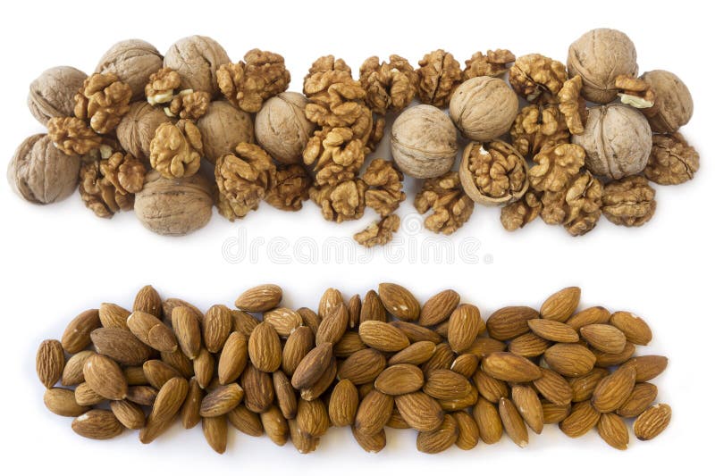 Walnuts and almonds on a white background. Nuts with copy space for text. Kernels walnuts and almonds on a white backgrou