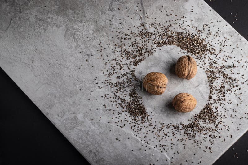 Walnuts on a Tile among Chia Seed Stock Photo Image of heap, seeds