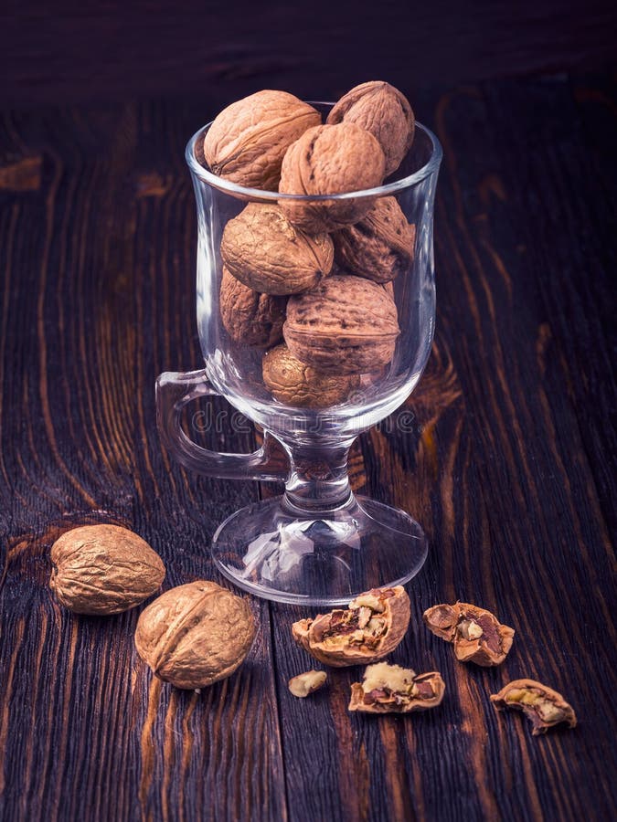 Walnuts on wooden table royalty free stock photo