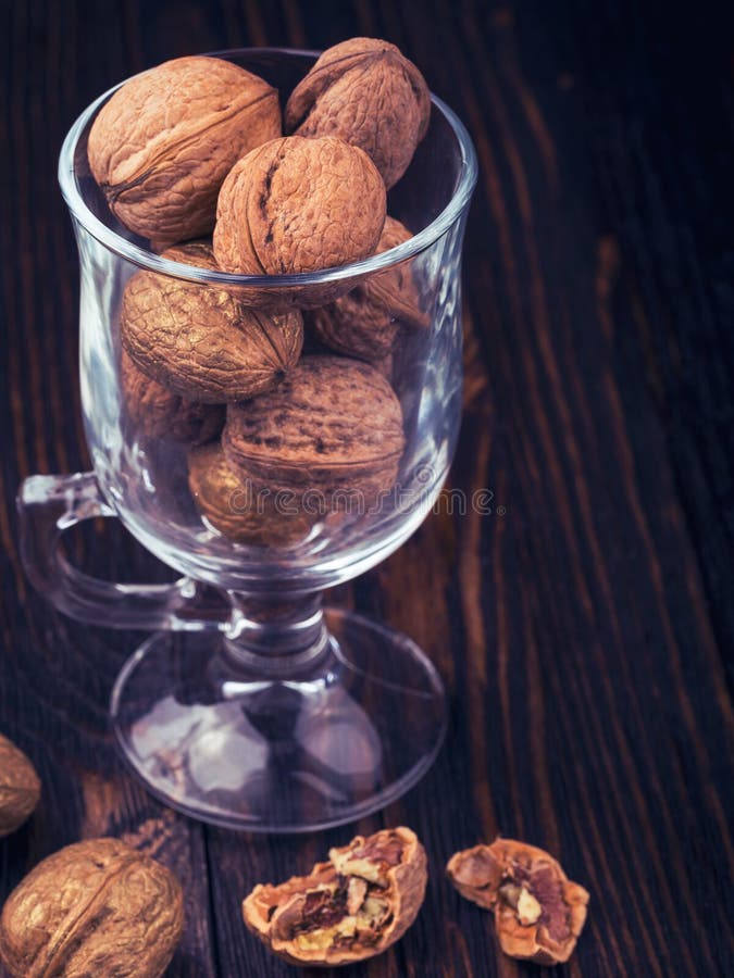 Walnuts on wooden table stock photo