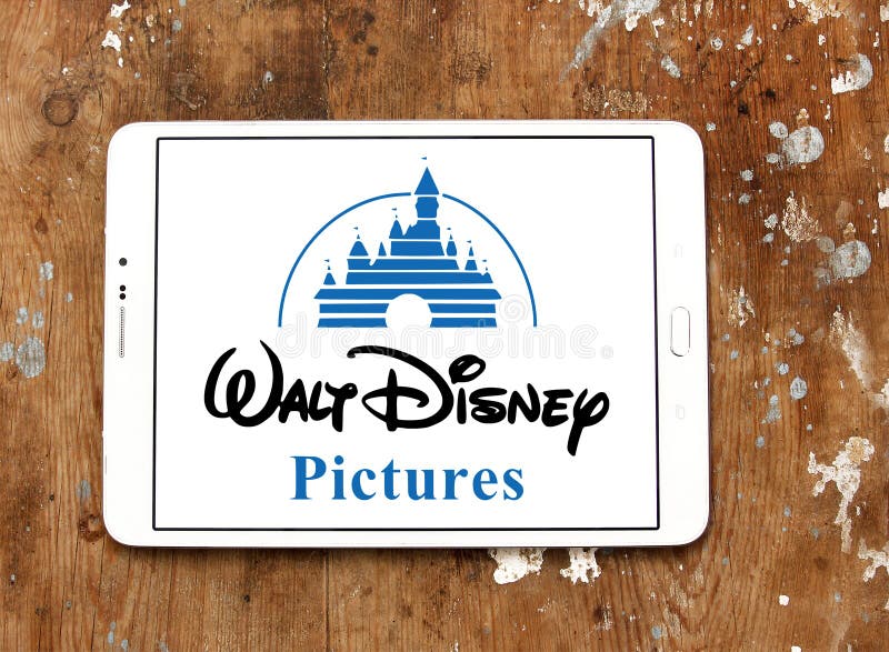 Logo of the american walt disney pictures on samsung tablet on wooden background. Logo of the american walt disney pictures on samsung tablet on wooden background