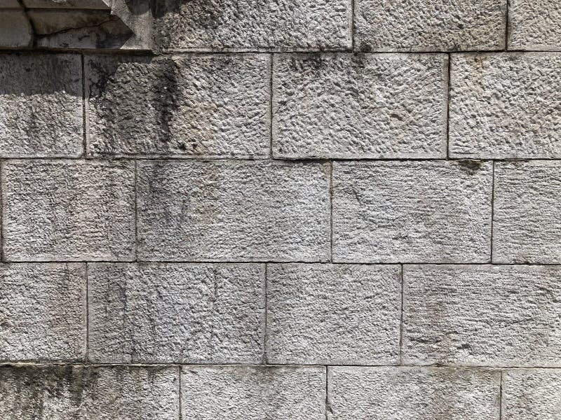 Wandbetonmauer aus Stein für Hintergrund oder Rendering stockbild