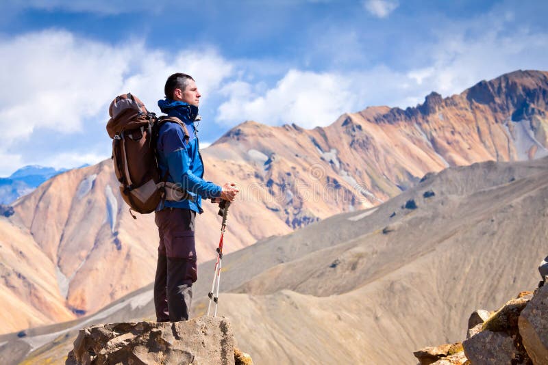 Hiker at the top of a rock. Travel in Iceland. Hiker at the top of a rock. Travel in Iceland