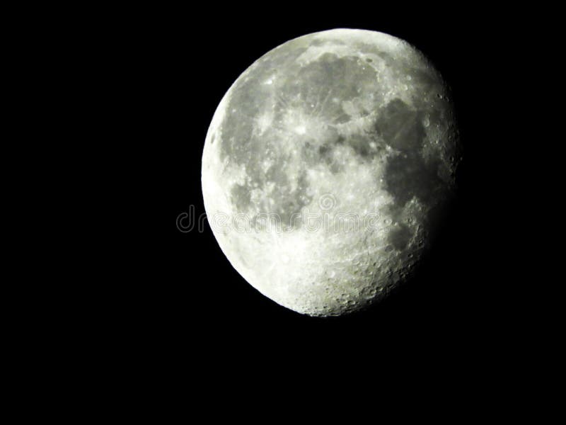 Waning Gibbous Moon at 92% full with meteorite craters stock photos