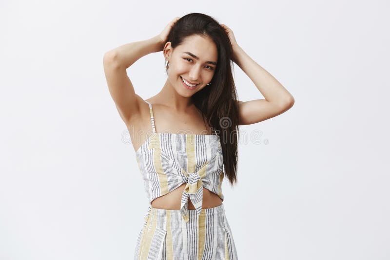 Wanna hang out together. Portrait of charming happy girlfriend with long beautiful and healthy dark hair, touching stock photography Wanna hang out together. Portrait of charming happy girlfriend with long beautiful and healthy dark hair, touching stock photography