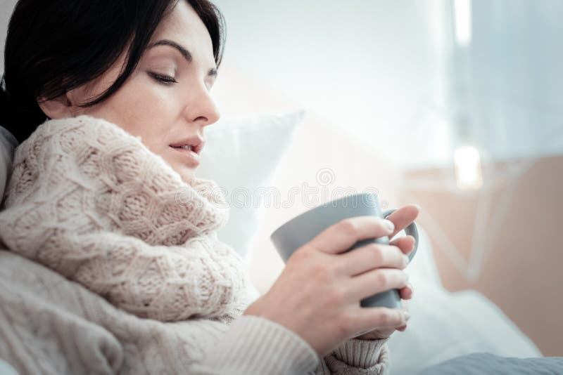 Tired Unhappy Woman Lying and Holding a Cup. Stock Image - Image of ...