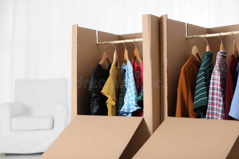 Wardrobe Boxes with Clothes on Hangers Stock Image Image of outfit