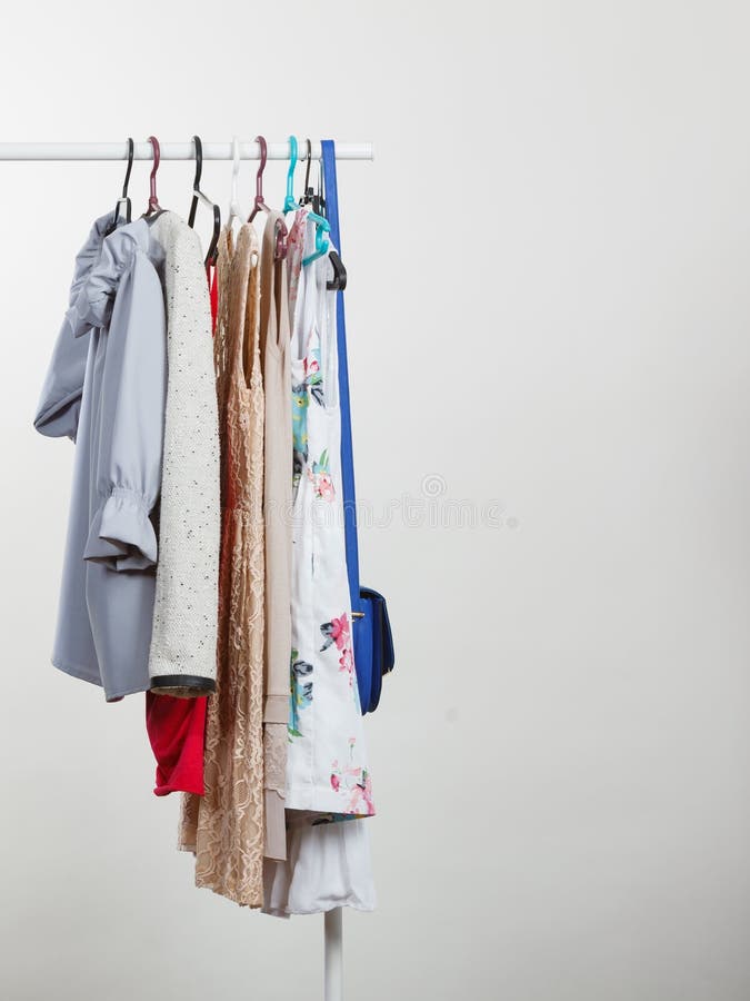 Clothes on Hangers in Closet Stock Photo - Image of closet, sale: 128013544