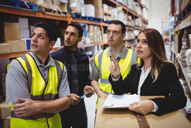 Warehouse Manager and Workers Talking Stock Image Image of serious