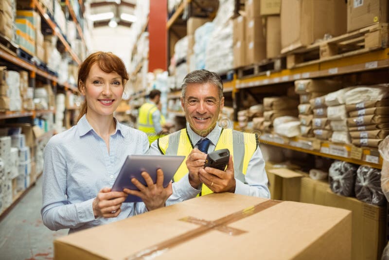 Warehouse managers smiling at camera royalty free stock photography