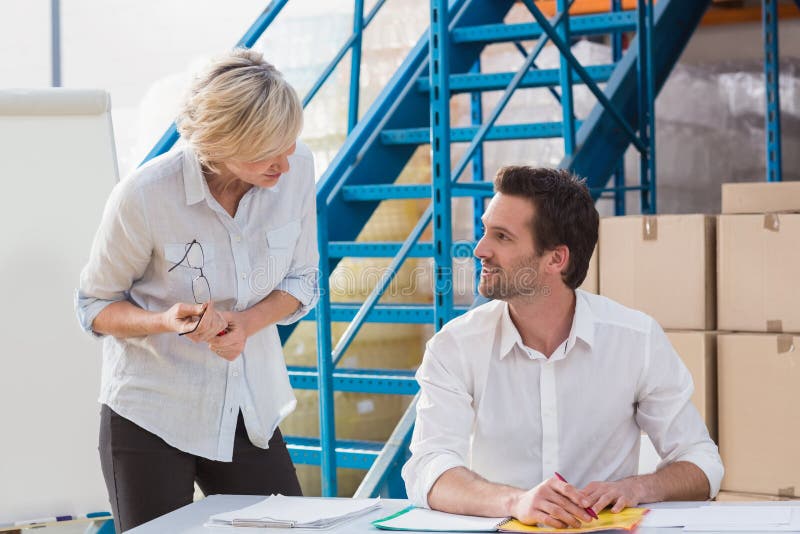 Warehouse managers speaking during a meeting stock image