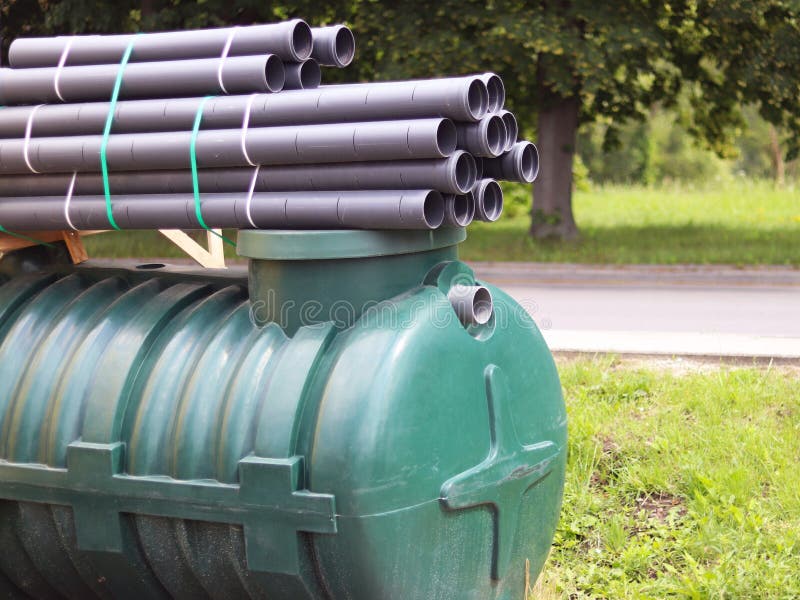 A warehouse of plastic pipes and container for various purposes or waste, diameter and color under the open sky. Manufacture and s stock photos A warehouse of plastic pipes and container for various purposes or waste, diameter and color under the open sky. Manufacture and s stock photos