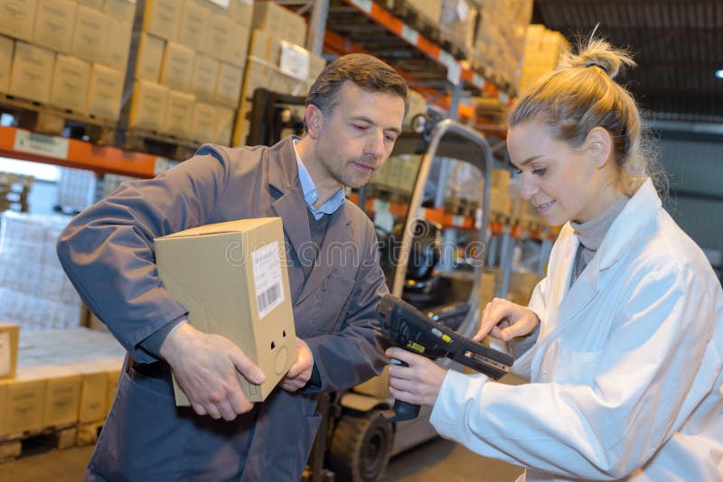Warehouse Worker Holding Carton Woman Programming Scanner Stock Photo