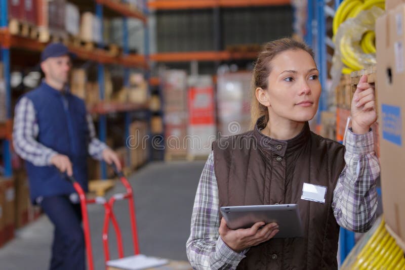 Warehouse worker scanning box in warehouse stock photo Warehouse worker scanning box in warehouse stock photo