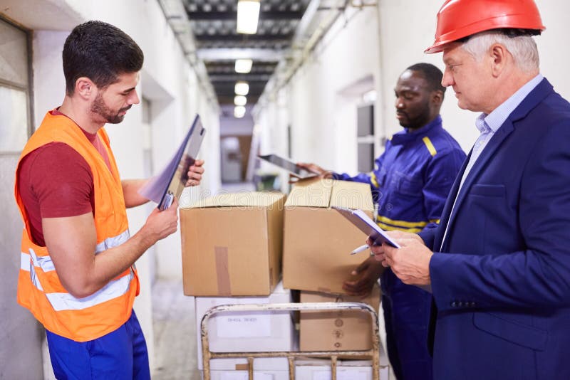 Warehouse Workers Team Controls Delivery of Goods Stock Photo Image