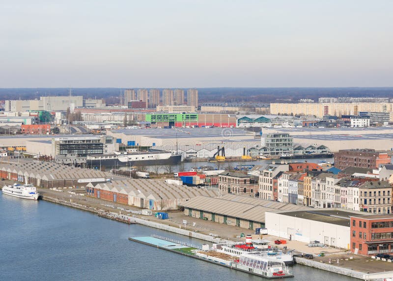 Warehouses by the River Scheldt in the port of Antwerp, Belgium. ANTWERP, BELGIUM - MARCH 7, 2015: View on warehouses by the River Scheldt in the port of Antwerp royalty free stock photos Warehouses by the River Scheldt in the port of Antwerp, Belgium. ANTWERP, BELGIUM - MARCH 7, 2015: View on warehouses by the River Scheldt in the port of Antwerp royalty free stock photos