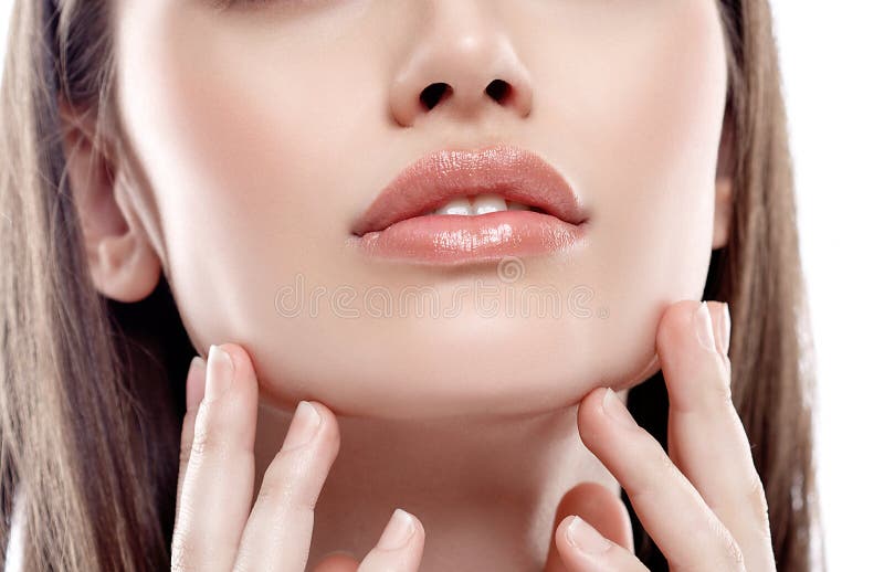 Lips nose chin Woman freckle happy young beautiful studio portrait with healthy skin touching her cheek with fingers. Lips nose chin Woman freckle happy young beautiful studio portrait with healthy skin touching her cheek with fingers