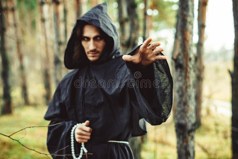 Warlock pointing finger stock photography