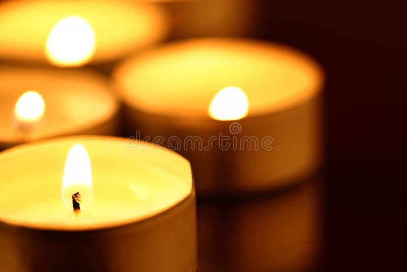Christmas Candles Burning at Night. Abstract Candles Background. Golden