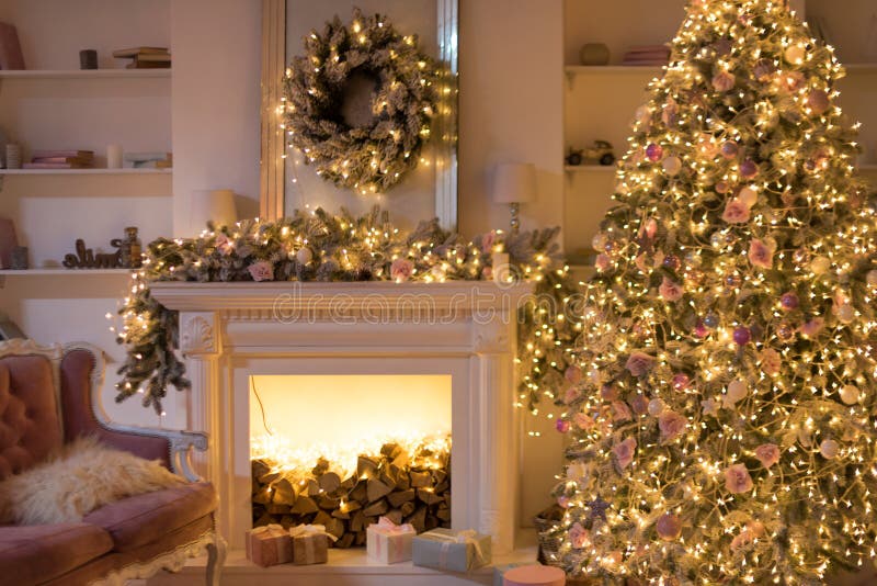 Warm cozy evening, Christmas eve, Christmas room with fireplace interior design, Xmas tree decorated by lights, gifts toys