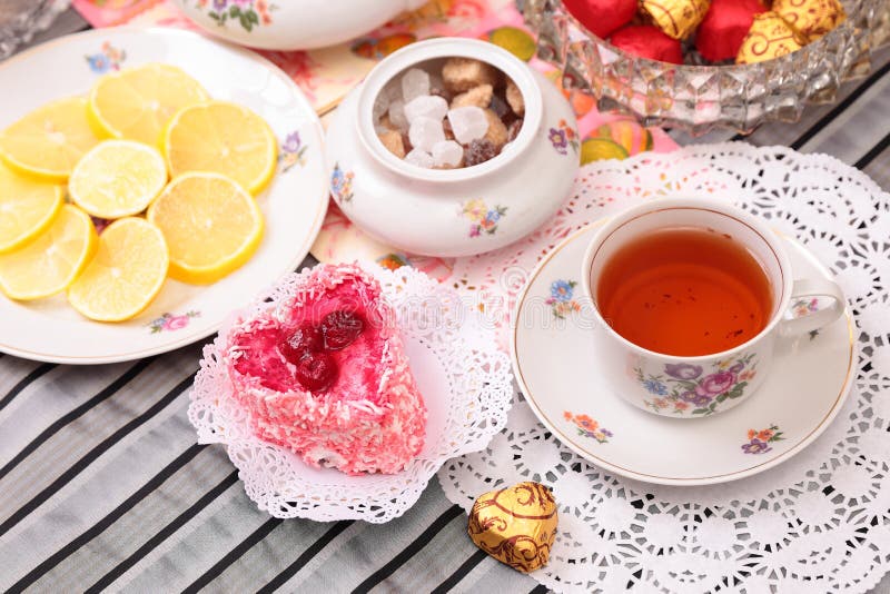 Warm cup of tea and sweets stock image. Image of rest 36950469