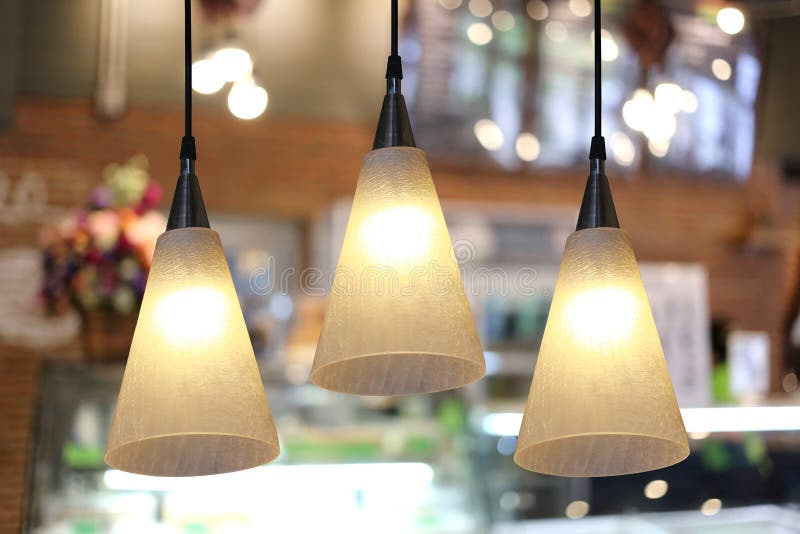 Warm Lighting Modern Ceiling Lamps in the Cafe. Stock Photo Image of