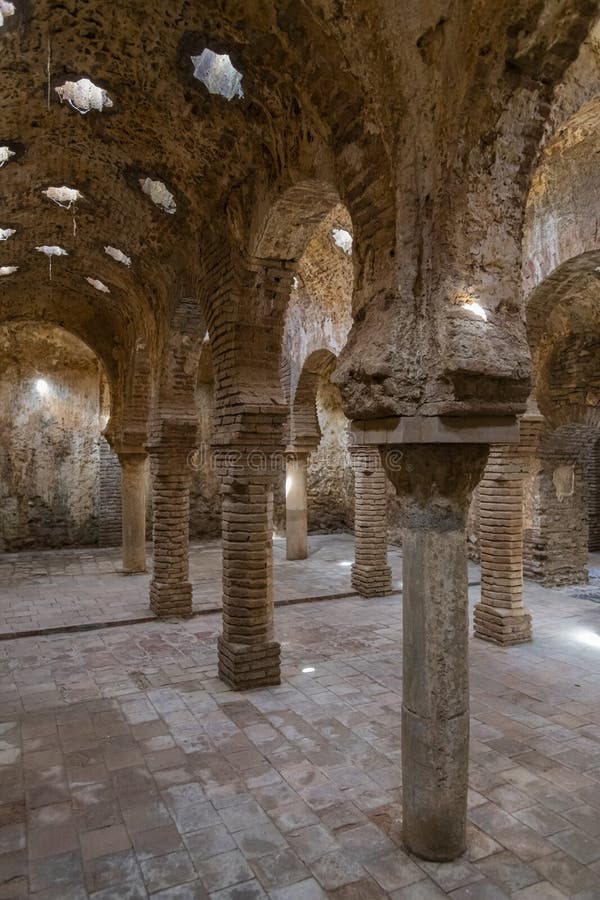 Ancient arab baths Ronda Spain. ”The warm room” in ancient arab baths with columns and arches in Ronda. Andalusia, Spain, Europe. The Arabic Bathhouses stock photo Ancient arab baths Ronda Spain. ”The warm room” in ancient arab baths with columns and arches in Ronda. Andalusia, Spain, Europe. The Arabic Bathhouses stock photo