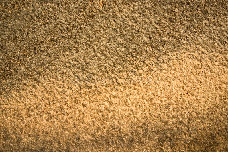 Warmly lit sandstone wall