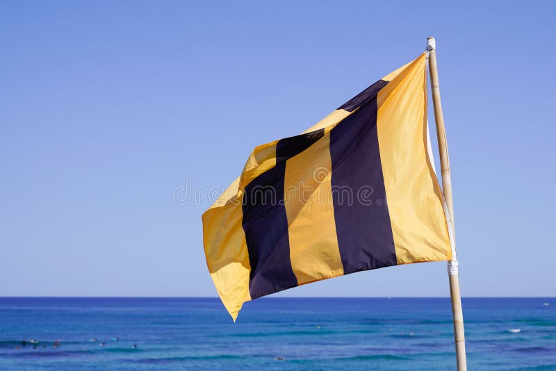 Warning Flag Yellow Black Vertical Line Blowing on the Beach on Sunny Day Stock Photo Image of