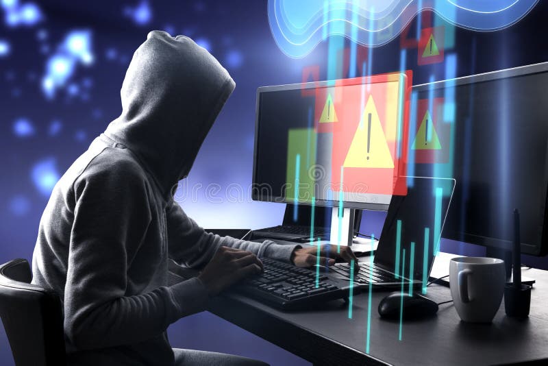 Warning system and cyber attack concept with side view on hacker in hoody working on computers and virtual data cloud network stock photo