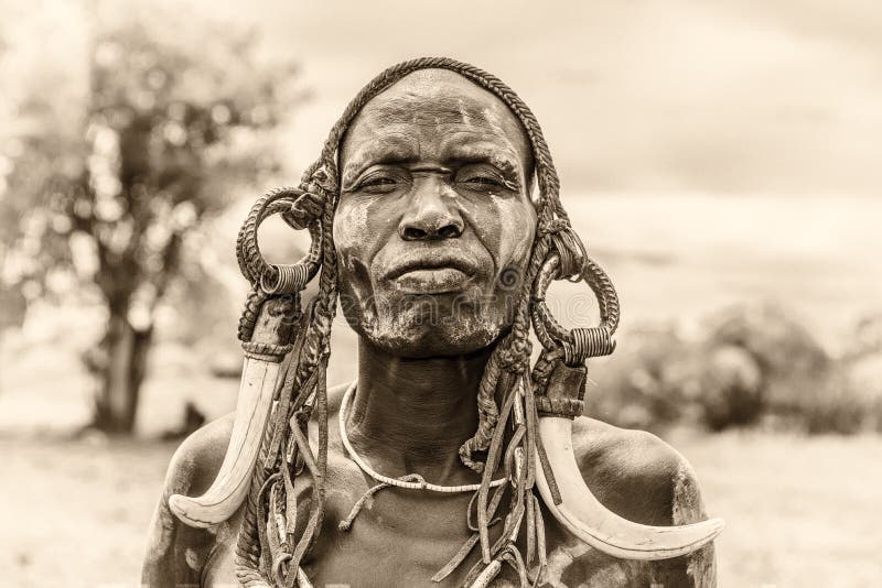 Warrior from the african tribe Mursi, Ethiopia stock photos Warrior from the african tribe Mursi, Ethiopia stock photos