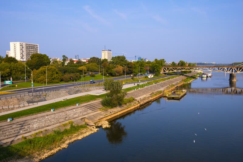 Warsaw, Poland - Panoramic view of the Vistula river with Most Srednicowy railway bridge and Powisle district of Warsaw