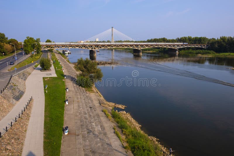 Warsaw, Poland - Panoramic view of the Vistula river with Most Srednicowy railway bridge and Powisle district of Warsaw