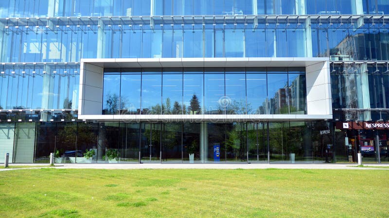 Architectural fragment of the entrance of the modern office building in Mokotow district. royalty free stock photos