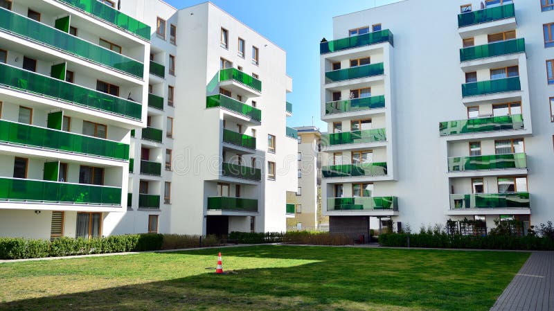 Modern apartment building in Bielany district on a sunny day with a blue sky. Facade of a modern apartment.