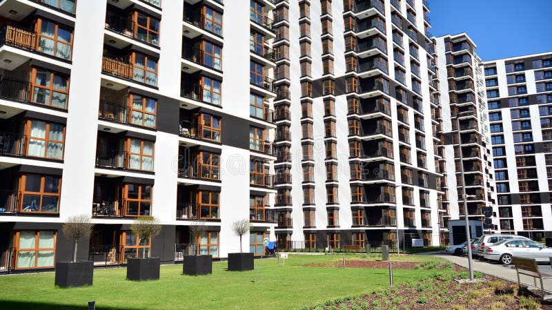 Modern apartment building in Bielany district on a sunny day with a blue sky. Facade of a modern apartment.