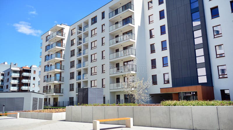 Modern apartment building in Bielany district on a sunny day with a blue sky. Facade of a modern apartment.