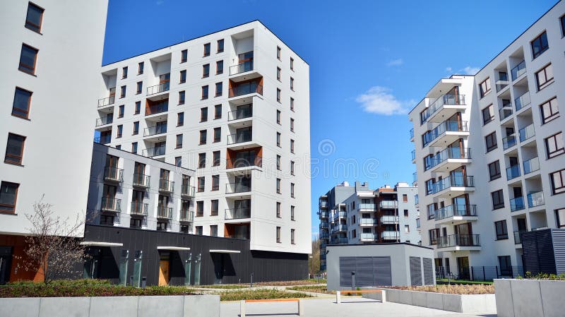Modern apartment building in Bielany district on a sunny day with a blue sky. Facade of a modern apartment.