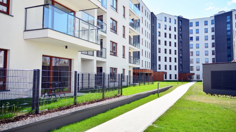 Modern apartment building in Bielany district on a sunny day with a blue sky. Facade of a modern apartment.